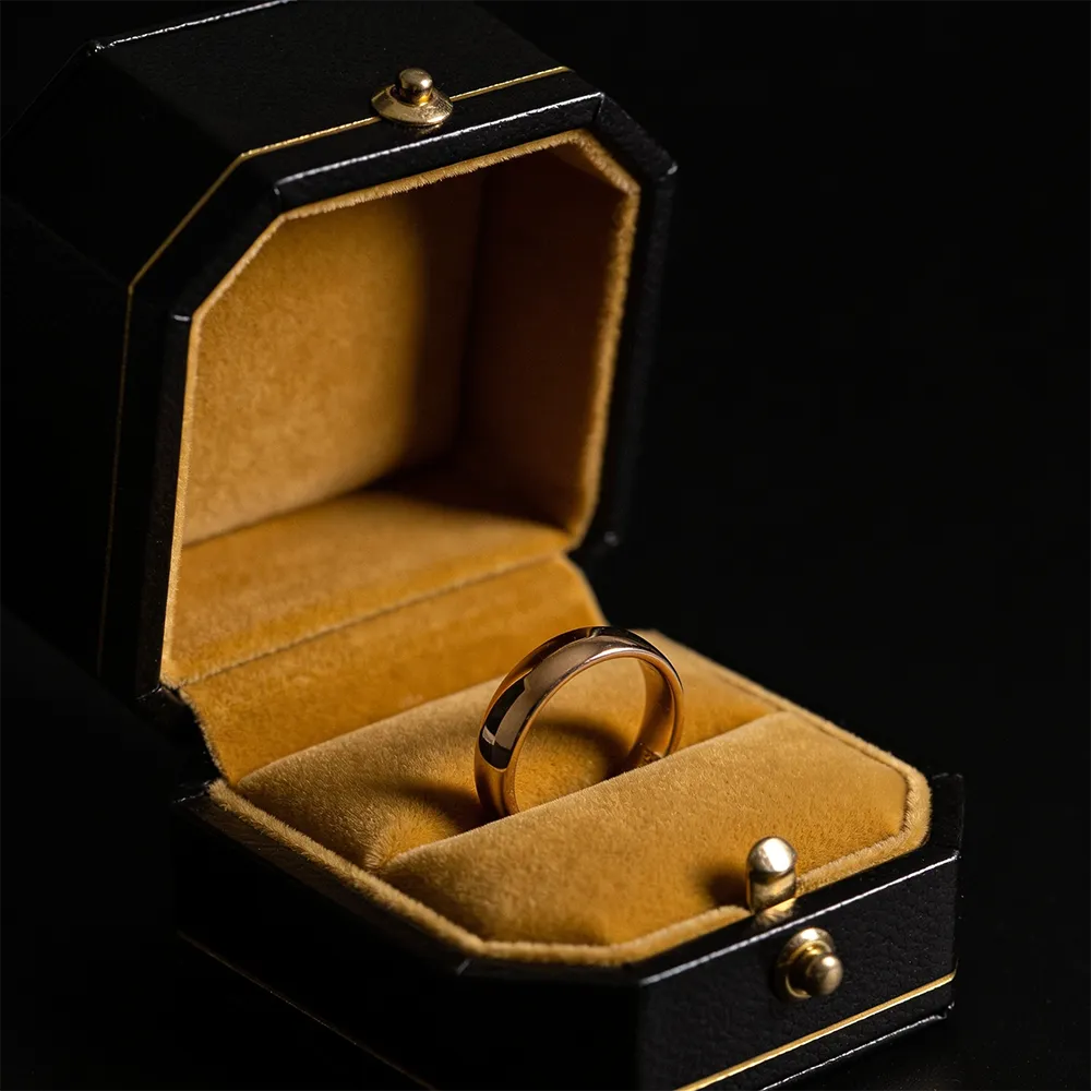 Gold wedding band in lacquer box